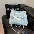 Elegant light blue faux leather tote bag with lace bow and gold metallic turn-lock - Blue