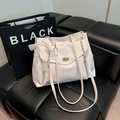 Elegant off-white PU leather crossbody bag with lace bow and golden swivel lock - White
