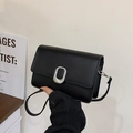 Minimalist black leather square flap bag for women featuring a sleek silver oval buckle - Black