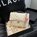 Elegant white quilted crossbody bag with golden clasp and decorative charms in a gift box - White With Pendant