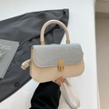 Mini beige square bag with silver glitter flap and gold twist lock in hand - Silver