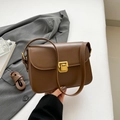 Classic dark brown leather crossbody bag with golden metal buckle and spare strap - Coffee