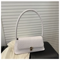 Detail of white woven leather texture and golden metal lock on a stylish baguette bag - White