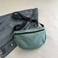 Mint green crescent messenger bag in durable nylon with adjustable black strap - Green