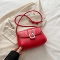 Glossy red faux leather crossbody bag with silver U-shaped buckle and knot shoulder strap - Red