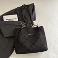 Chic black quilted tote bag with gold chain strap detail and textured fabric finish - Black