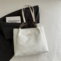 White textured shoulder tote bag with gold chain strap and leather brand label - White