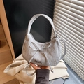 Silver-gray crescent crossbody bag with pleated texture and stylish bow detail - Silver