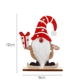 Wooden Christmas gnome decor with red striped hat and gift box on a stable wood base - Red Faceless Gnome