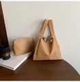 Close-up of lychee grain texture and magnetic buckle on light brown tote bag - Khaki