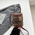 Cylindrical leopard print bucket bag with brown leather contrast and gold hardware - Leopard Print Coffee