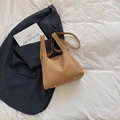 Light brown lychee texture PU tote bag with gold feet on a stylish lifestyle background - Khaki
