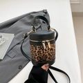 Cylindrical bucket bag featuring brown leopard print panel and black leather trim - Black Leopard Print