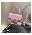Detail of the pink leather bag showing the mix of textured litchi and smooth grain finish - Pink