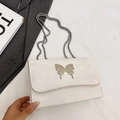 White fashion chain bag with silver butterfly buckle and textured finish for women - White