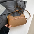 Brown textured underarm bag with elegant bow detail and golden hardware finish - Brown