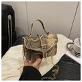 Detailed view of snake skin texture flap bag with gold chain strap and metal clasp closure - Khaki