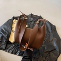 Chic brown crescent hobo bag with adjustable wide shoulder strap and gold hardware - Coffee