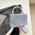 Light blue chic underarm bag with leather strap accents and gold metal hardware trim - Blue