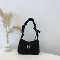 Chic black pleated shoulder bag with metallic butterfly detail and adjustable strap - Black