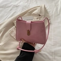 Pink croc-embossed crossbody bag with vintage bronze lock and knot strap detail - Pink