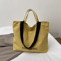 Borsa tote minimalista in tela giallo brillante con manici neri e stampa di lettere - Giallo