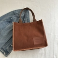 Brown corduroy tote bag with vintage leather patch and durable handles for daily commute - Brown
