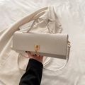 Chic off-white woven shoulder bag with gold clasp and top handle in a minimalist style - White