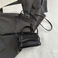 Minimalist black quilted crossbody bag with stylish wave pattern leather flap - Black