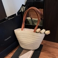 Beige woven straw tote bag with brown PU handles and yellow tulips in life scene - With Pendant / Beige
