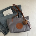 Grey nylon tote bag with brown leather straps and cute plush bear charm accessory - With Pendant / L / Dark Gray