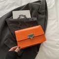 Chic vibrant orange patent leather crossbody bag with chain strap and metal clasp lock - Orange