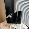 Minimalist black tote bag with glossy finish and elegant pearl lace bow charm decoration - Black