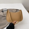 Minimalist camel baguette shoulder bag with pebbled leather texture and silver zipper - Brown