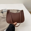 Minimalist dark brown baguette bag with pebbled leather texture and shoulder strap - Brown