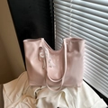 Pink faux leather tote bag with pearl bow pendant and lace trim in a soft morning light - Pink With Pendant
