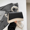 Minimalist black and white square bag featuring an artistic silver liquid metal handle - Black