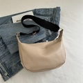Minimalist beige hobo bag with wide black fabric strap and fashion lettering - Khaki