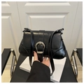 Detail of black glossy oil wax leather bag with silver horseshoe buckle and stitching - Black
