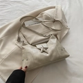 Beige faux leather crescent moon bag with silver star rivets and Y2K aesthetic design - Off White