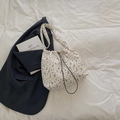 Floral nylon drawstring bucket bag in off-white with purple flower pattern and wide strap - Gray