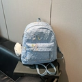 Light blue quilted backpack with bow accents and plush cloud charm on books - With Pendant / Small / Blue