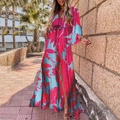 Detail showing deep V-neckline and floral print patterns on the vibrant summer maxi dress - Blue and Red Print (With Belt)