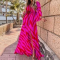 Detail view of pink and red zebra print maxi dress with V-neck and high side slit - Fuchsia Zebra Print (With Belt)