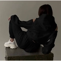 Detail of black off-shoulder hoodie and matching drawstring joggers set in soft fleece - 3XL / Black