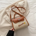 Borsa a tracolla in tela beige e pelle marrone con ricamo timeto e manico rotondo - Marrone