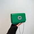 Green leather crossbody bag with sparkling rhinestone buckle and silver chain strap - Green