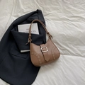 Brown leather shoulder bag with silver eyelets and buckle closure on a white fabric base - Khaki