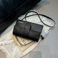 Elegant black crossbody flap bag with gold lettering and slim shoulder strap - With Pendant / Black