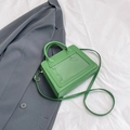 Structured grass green ita crossbody bag in glossy finish with dual handles - Green